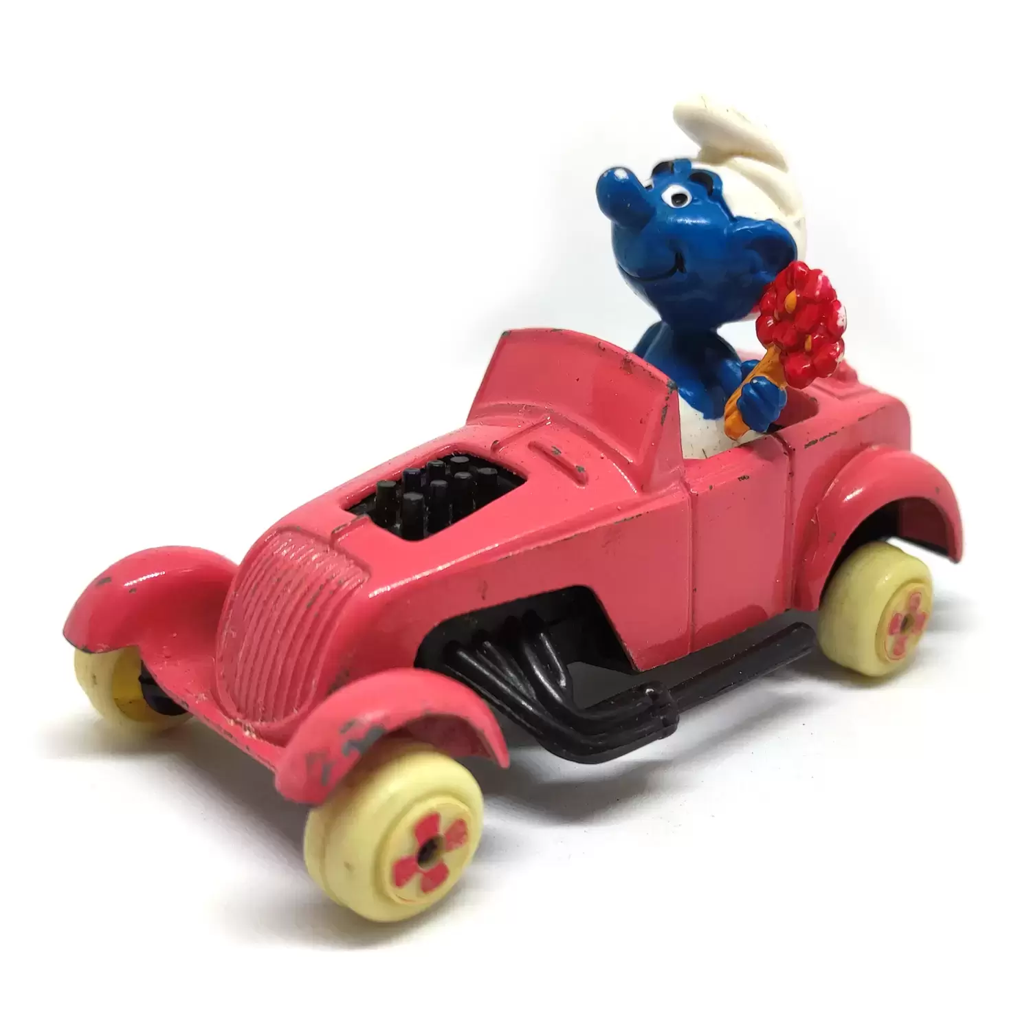 Puffi ESCI / ORLI JOUET (Die Cast Metal) - Schtroumpf avec bouquet dans voiture rose
